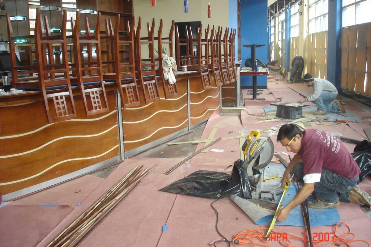 Custom wave-pattern commercial floor installation in progress
